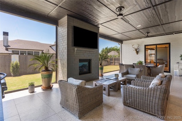 6038 E 119th Pl, Tulsa, OK 74137 - fenced backyard with a patio area, an outdoor living space with a fireplace, and ceiling fan