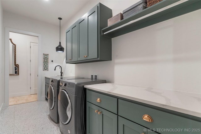 6038 E 119th Pl, Tulsa, OK 74137 - laundry area with cabinet space and washer and clothes dryer