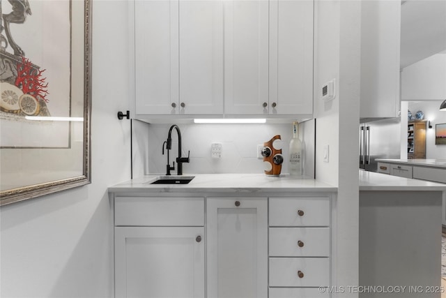 6038 E 119th Pl, Tulsa, OK 74137 - kitchen featuring white cabinets and backsplash