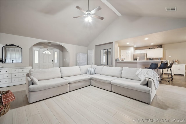 1905 Walnut Hill Ln, Claremore, OK 74019 - living area featuring a ceiling fan, high vaulted ceiling, light wood-style flooring, arched walkways, and recessed lighting