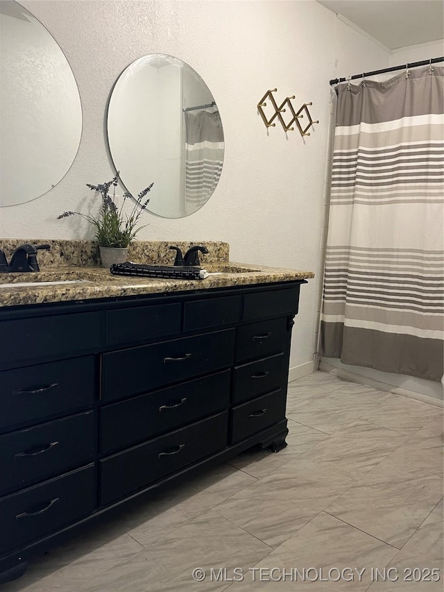 918 W Cedar St, Durant, OK 74701 - full bathroom with marble finish floors and double vanity