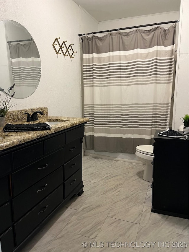 918 W Cedar St, Durant, OK 74701 - bathroom with toilet, vanity, ornamental molding, marble finish flooring, and a shower with shower curtain
