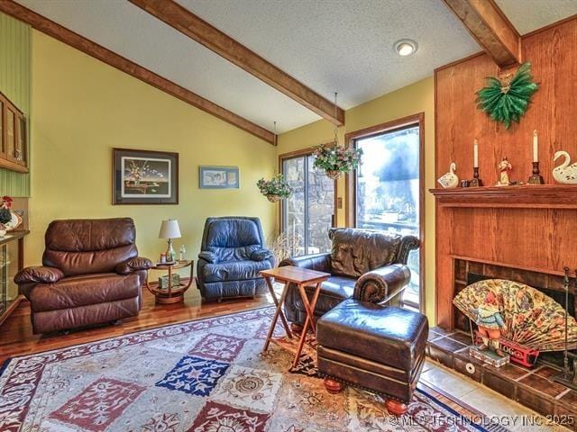 sitting room featuring wood finished floors and a textured ceiling