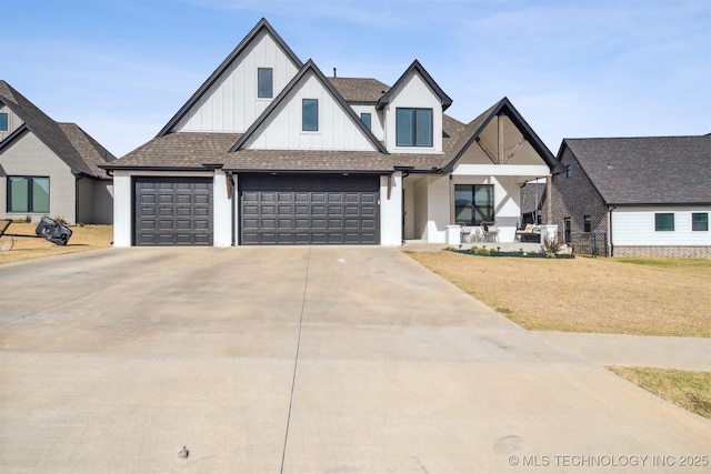 modern farmhouse featuring board and batten siding, covered porch, an attached garage, concrete driveway, and a shingled roof