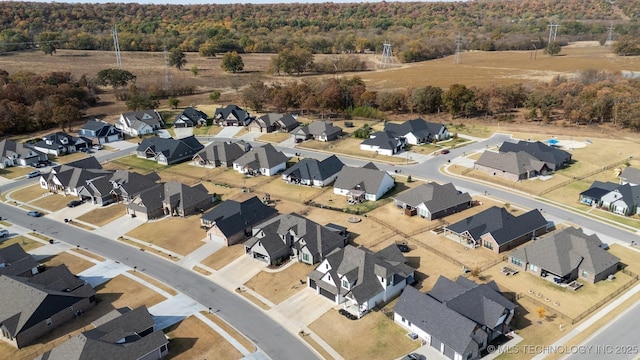 aerial overview of property's location featuring a heavily wooded area and nearby suburban area