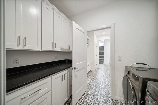 washroom with washing machine and clothes dryer, cabinet space, baseboards, recessed lighting, and light tile patterned floors