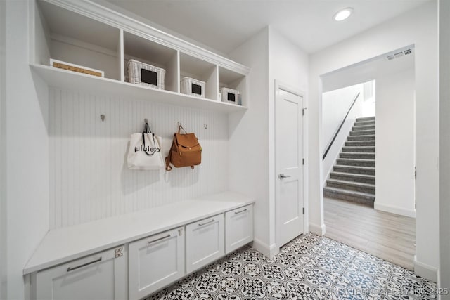 mudroom featuring baseboards and recessed lighting