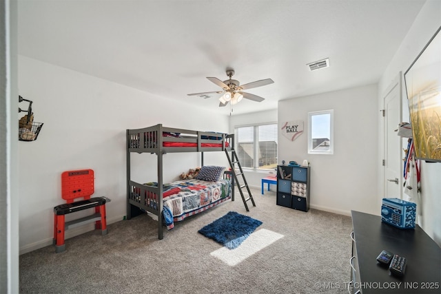 carpeted bedroom with baseboards and a ceiling fan