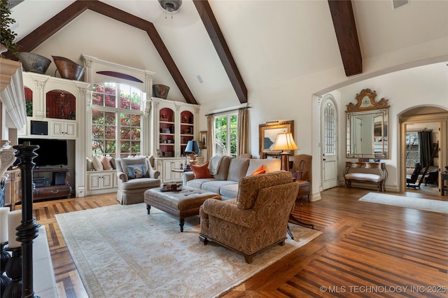 11616 S Hudson Ct, Tulsa, OK 74137 - living room featuring high vaulted ceiling, arched walkways, and beam ceiling