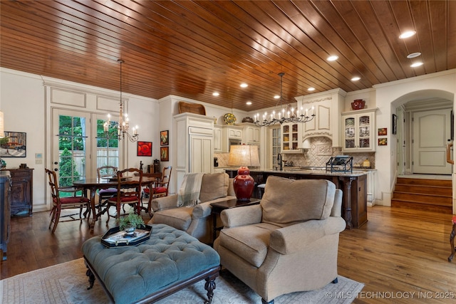 11616 S Hudson Ct, Tulsa, OK 74137 - living room featuring a chandelier, arched walkways, wooden ceiling, dark wood-style flooring, and recessed lighting