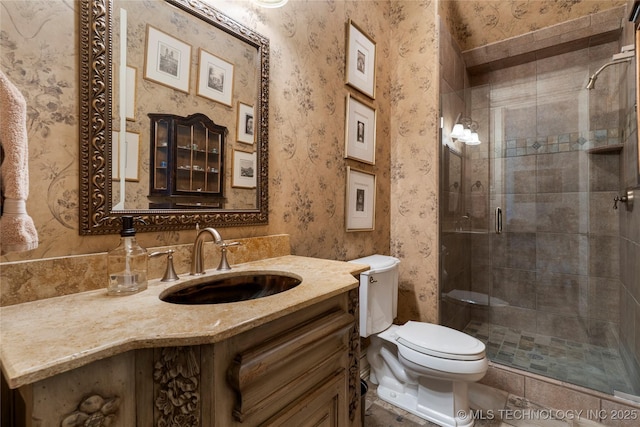 11616 S Hudson Ct, Tulsa, OK 74137 - bathroom featuring wallpapered walls, toilet, a stall shower, and vanity