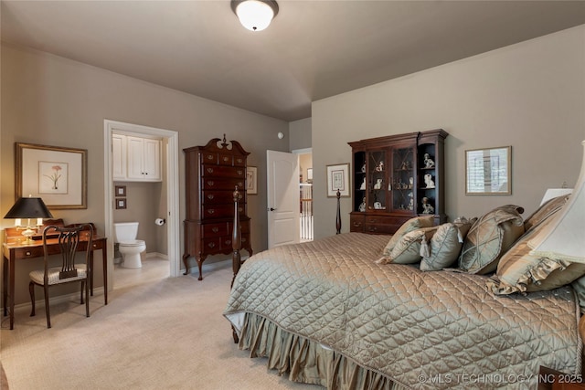 11616 S Hudson Ct, Tulsa, OK 74137 - bedroom with light colored carpet, connected bathroom, and baseboards