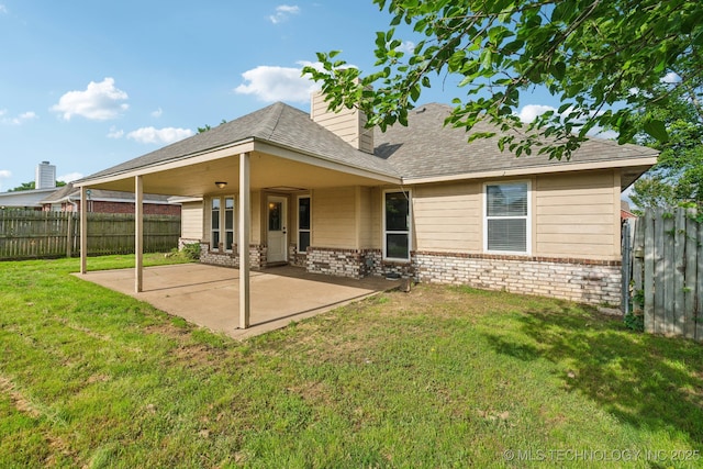 4719 S 194th E Ave, Broken Arrow, OK 74014 - back of house with brick siding, a patio, a shingled roof, and a chimney