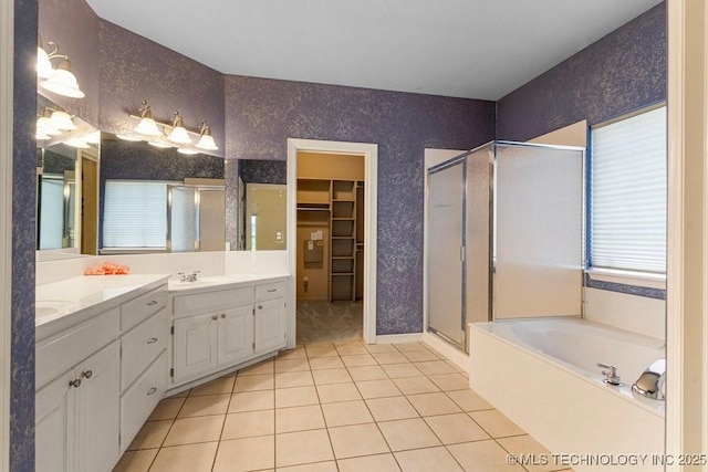 8531 S 70th E Ave, Tulsa, OK 74133 - full bathroom featuring a stall shower, double vanity, tile patterned flooring, and a walk in closet