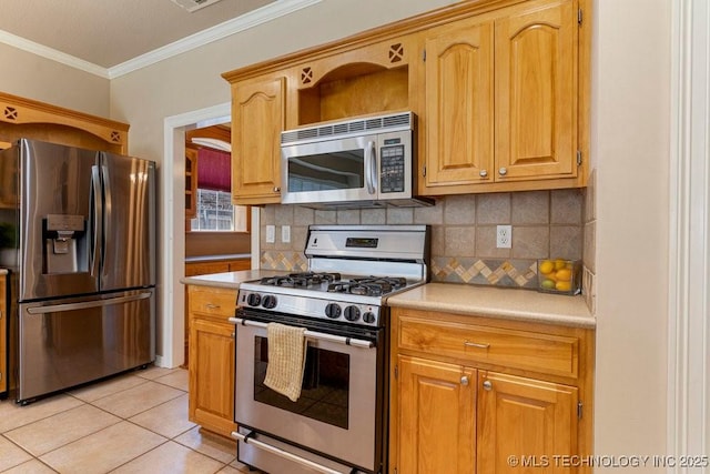 8531 S 70th E Ave, Tulsa, OK 74133 - kitchen featuring stainless steel appliances, light countertops, ornamental molding, decorative backsplash, and light tile patterned floors