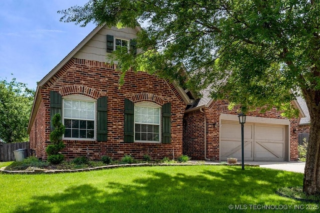 8531 S 70th E Ave, Tulsa, OK 74133 - view of front facade featuring brick siding, a garage, and concrete driveway