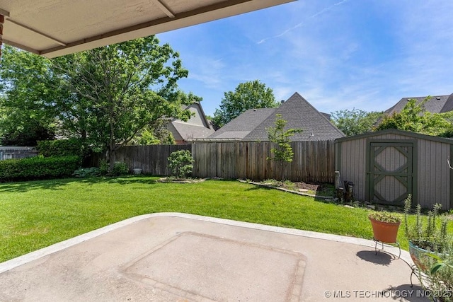 8531 S 70th E Ave, Tulsa, OK 74133 - view of yard featuring a patio, a storage unit, and an outdoor structure