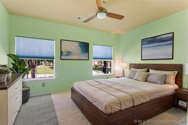 8531 S 70th E Ave, Tulsa, OK 74133 - bedroom featuring light colored carpet, baseboards, and a ceiling fan