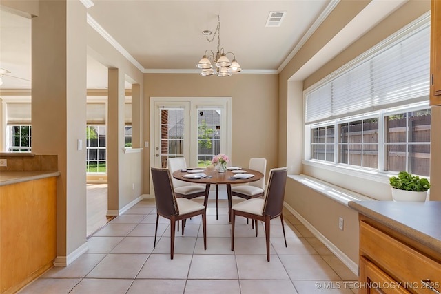 8531 S 70th E Ave, Tulsa, OK 74133 - dining space featuring ornamental molding, a chandelier, light tile patterned floors, and baseboards