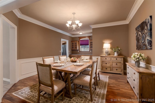 8531 S 70th E Ave, Tulsa, OK 74133 - dining area featuring ornamental molding, wainscoting, a chandelier, and wood finished floors
