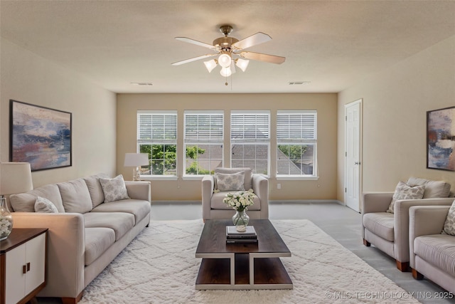 8531 S 70th E Ave, Tulsa, OK 74133 - living room featuring light carpet, ceiling fan, plenty of natural light, and baseboards
