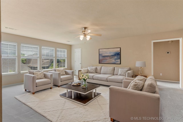 8531 S 70th E Ave, Tulsa, OK 74133 - living room featuring light carpet, ceiling fan, and baseboards