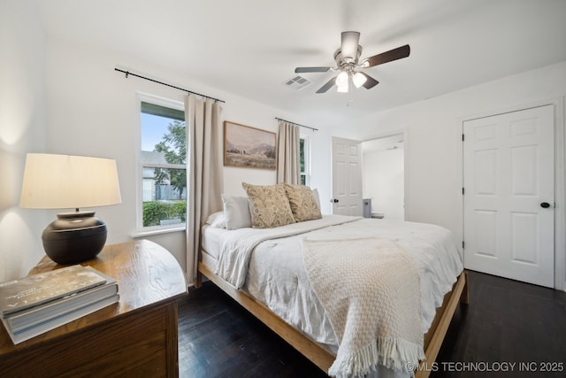 bedroom with dark wood finished floors and ceiling fan
