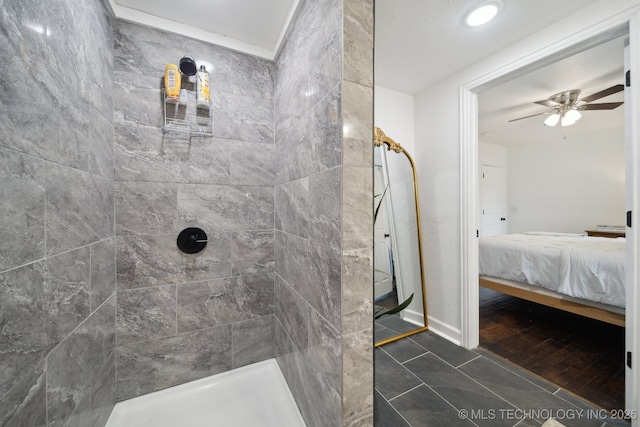 full bathroom featuring ensuite bathroom, tiled shower, and ceiling fan