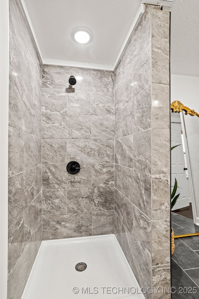 bathroom with tiled shower