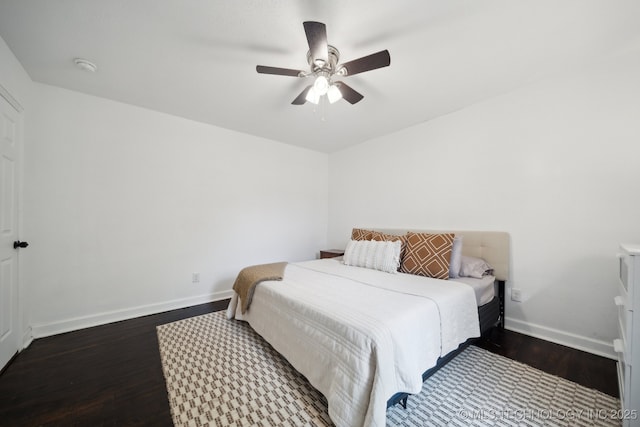 bedroom with wood finished floors, baseboards, and a ceiling fan