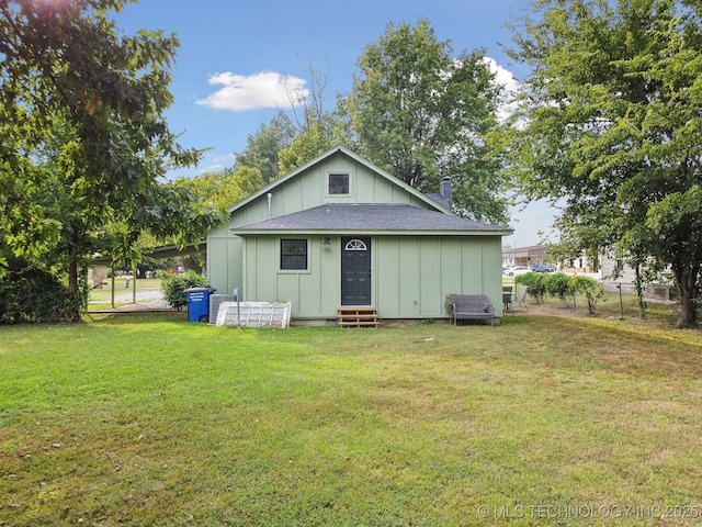 rear view of house featuring entry steps and board and batten siding