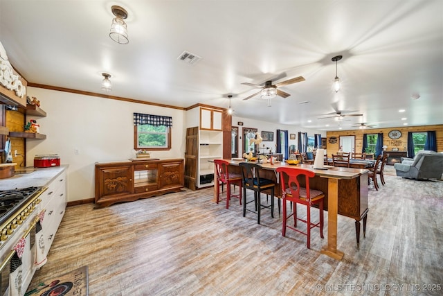 6019 E 620th Rd W, Locust Grove, OK 74352 - kitchen featuring range, open shelves, healthy amount of natural light, and open floor plan