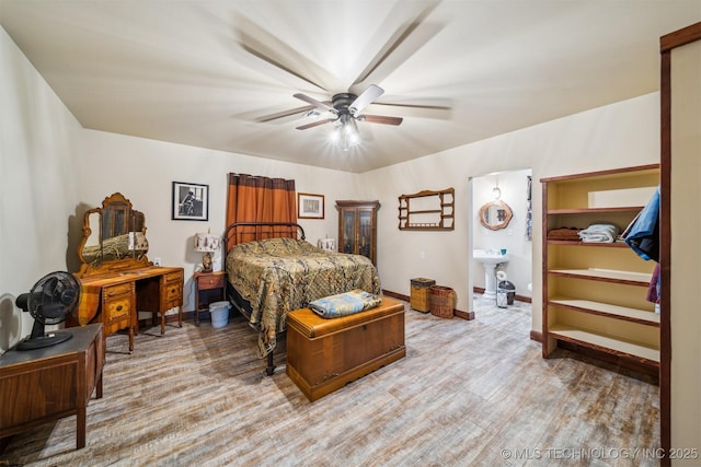 6019 E 620th Rd W, Locust Grove, OK 74352 - bedroom featuring baseboards, wood finished floors, ceiling fan, and connected bathroom