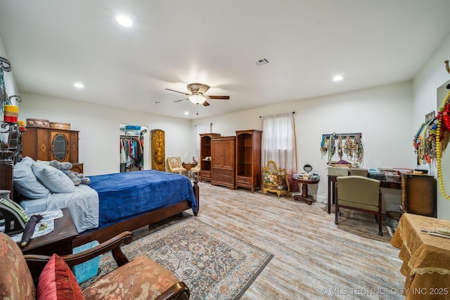 6019 E 620th Rd W, Locust Grove, OK 74352 - bedroom with recessed lighting, a ceiling fan, wood finished floors, and a walk in closet