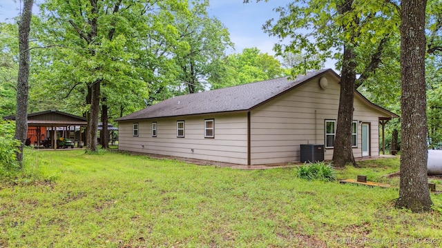 6019 E 620th Rd W, Locust Grove, OK 74352 - view of property exterior featuring central AC unit and a yard