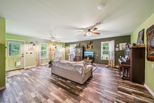 6019 E 620th Rd W, Locust Grove, OK 74352 - living room with ceiling fan, wood finished floors, baseboards, and heating unit