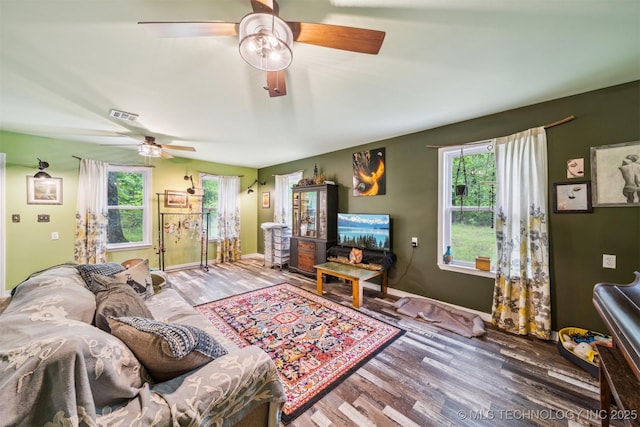 6019 E 620th Rd W, Locust Grove, OK 74352 - living room featuring a ceiling fan, wood finished floors, and baseboards