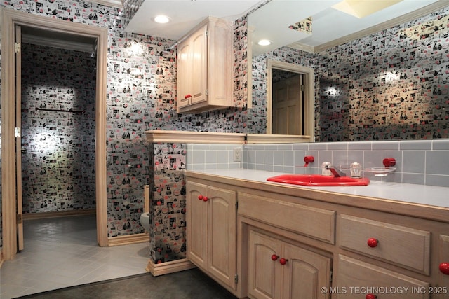 5941 E 87th St, Tulsa, OK 74133 - bathroom featuring wallpapered walls, tile patterned floors, ornamental molding, vanity, and baseboards