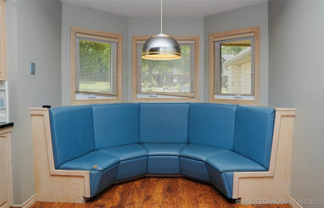 5941 E 87th St, Tulsa, OK 74133 - unfurnished living room featuring healthy amount of natural light and wood finished floors