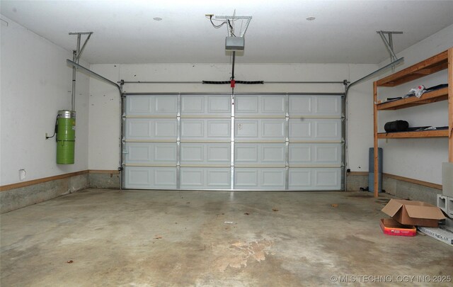 5941 E 87th St, Tulsa, OK 74133 - garage with a garage door opener and a central vacuum unit