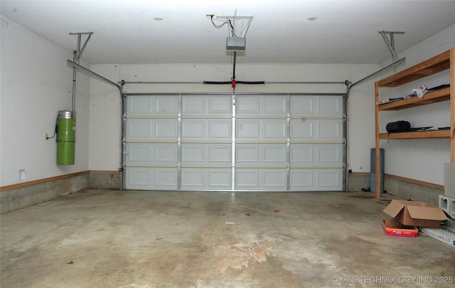 5941 E 87th St, Tulsa, OK 74133 - garage featuring a garage door opener and a central vacuum unit