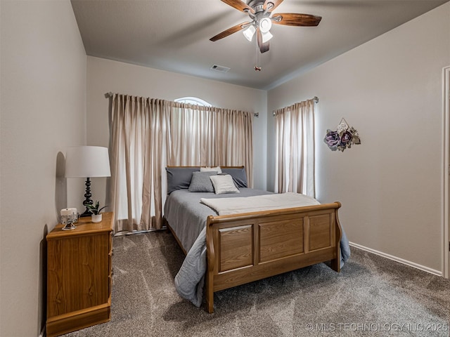 bedroom with dark carpet, baseboards, and a ceiling fan