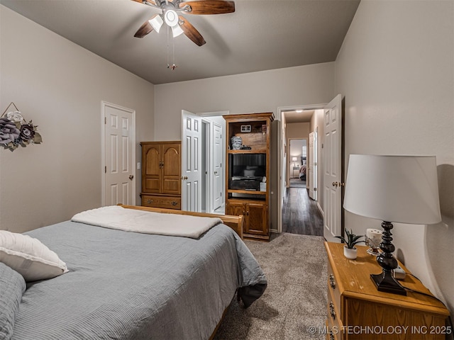 carpeted bedroom with a ceiling fan