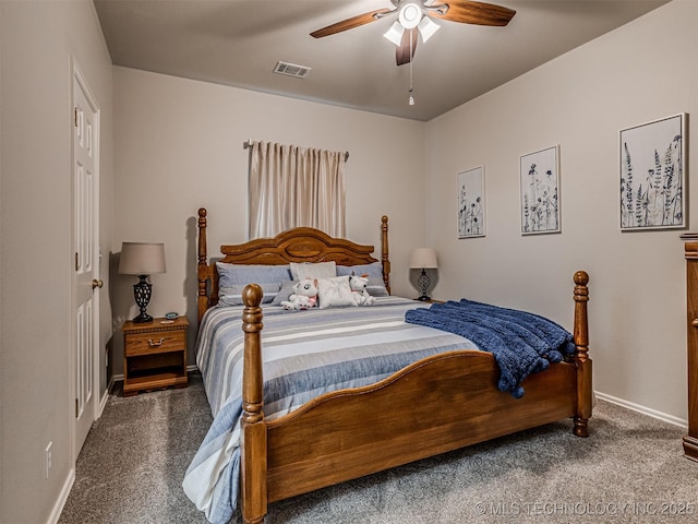 carpeted bedroom featuring baseboards and a ceiling fan