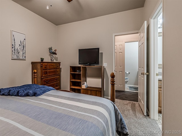 bedroom with carpet flooring and ensuite bath