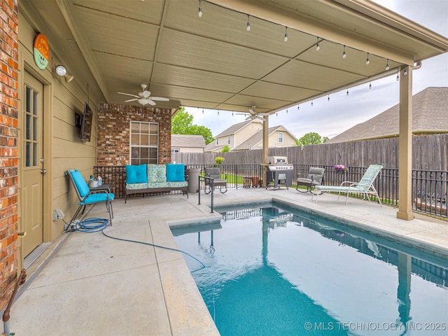 view of swimming pool with a fenced backyard, a patio area, a ceiling fan, and area for grilling