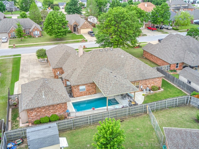 aerial perspective of suburban area featuring a pool area