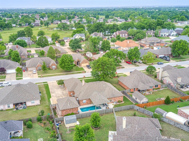 aerial perspective of suburban area with a pool area