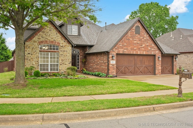 traditional-style house with a garage, stone siding, driveway, roof with shingles, and brick siding