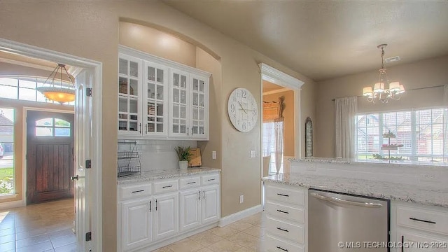 kitchen with dishwasher, light tile patterned floors, and healthy amount of natural light